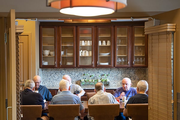 Men enjoying breakfast in the formal dining room